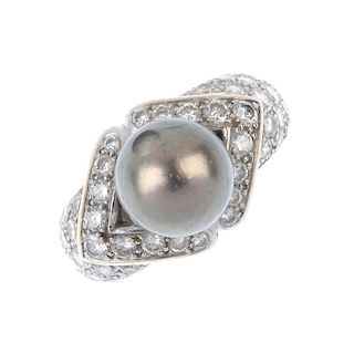 A cultured pearl and diamond dress ring. The cultured pearl, measuring approximately 10mms, to the p