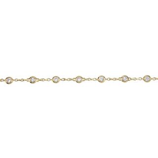 An 18ct gold diamond bracelet. Designed as a series of old-cut diamond collets, to the fancy-link ch