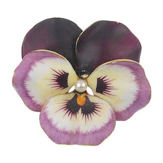 A mid 20th century seed pearl and enamel pansy brooch. The seed pearl, within a white and purple ena