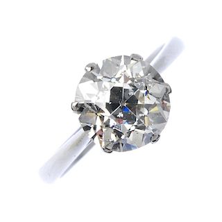 A platinum diamond single-stone ring. The old-cut diamond, weighing 2.91cts, to the tapered band. Ac