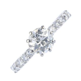 A diamond single-stone ring. The old-cut diamond, to the brilliant-cut diamond line sides and plain