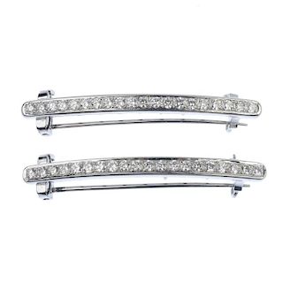 A pair of diamond hair ornaments. Each hair clip designed as a brilliant-cut diamond line, to the co