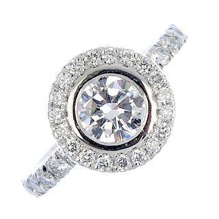 A platinum diamond cluster ring. The brilliant-cut diamond, with similarly-cut diamond surround and