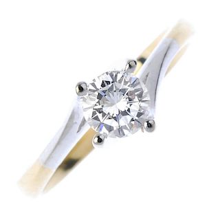An 18ct gold diamond single-stone ring. The brilliant-cut diamond, to the bi-colour spiral mount and