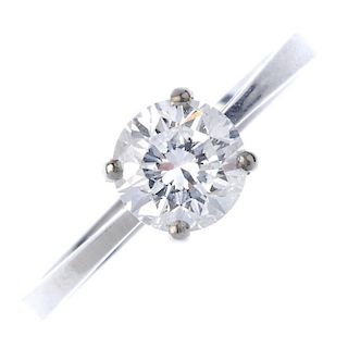 A platinum diamond single-stone ring. The brilliant-cut diamond, to the plain band. Estimated diamon