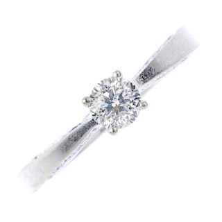An 18ct gold diamond single-stone ring. The brilliant-cut diamond, to the similarly-cut diamond gall