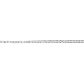 A mid 20th century platinum diamond line bracelet. Designed as a series of brilliant-cut diamonds, e