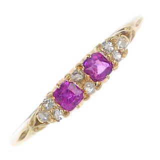 A late Victorian 18ct gold ruby and diamond ring. The square-shape ruby, with old-cut diamond double