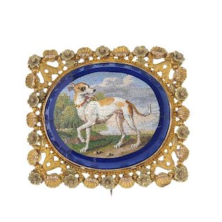 A late 19th century micro mosaic brooch. The oval micro mosaic, depicting an Italian greyhound, to t