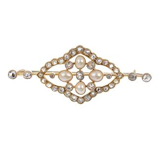 An early 20th century gold split pearl and diamond brooch. The old-cut diamond cross with split pear