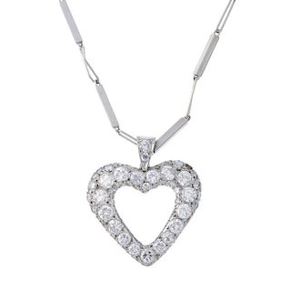 A diamond heart pendant. The pave-set diamond heart, suspended from a fancy-link chain. Estimated to