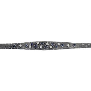 A sapphire and diamond bracelet. Designed as a series of brilliant-cut diamond and circular-shape sa