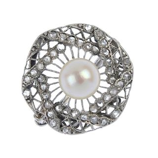 An early 20th century platinum cultured pearl and diamond dress ring. The cultured pearl measuring,