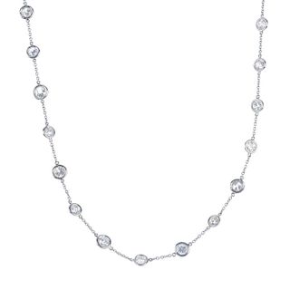 An 18ct gold diamond necklace. Designed as an old and circular-cut diamond collet line, spaced along