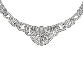 A diamond necklace. Of geometric design, the brilliant-cut diamond collet with baguette-cut diamond