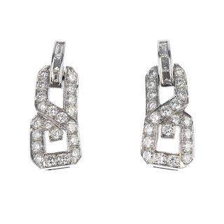 A pair of diamond ear pendants. Each of geometric design, the brilliant-cut diamond openwork panel,