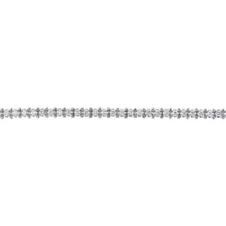 An 18ct gold diamond bracelet. The illusion-set brilliant-cut diamond line, to the partially conceal