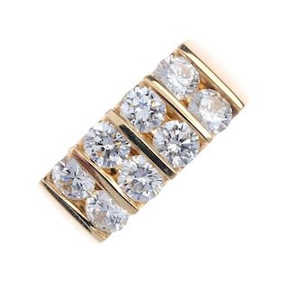 A diamond two-row ring. Designed as two rows of brilliant-cut diamonds, with plain bar spacers, to t
