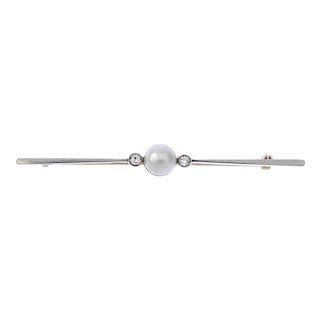 A cultured pearl and diamond bar brooch. The cultured pearl measuring 6.3mms, to the old-cut diamond