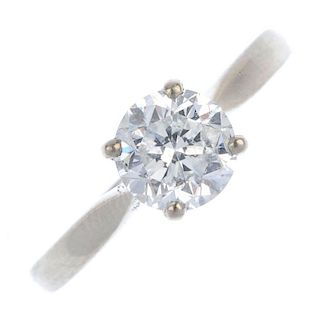 An 18ct gold diamond single-stone ring. The brilliant-cut diamond, weighing 1.18cts, to the plain ba