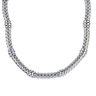 ASPREY & GARRARD - an 18ct gold collar. Designed as a series of curved bar links with lattice detail