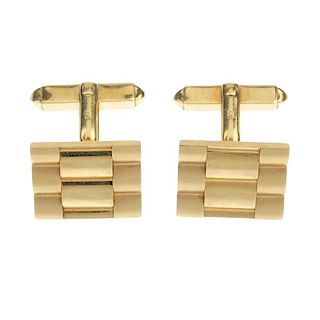 BOODLES - a pair of 18ct gold cufflinks. Each designed as a watch bracelet link, to the bifurcated c