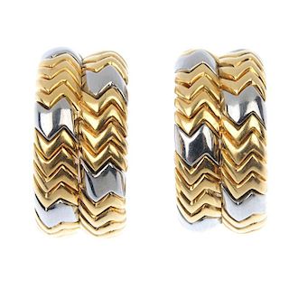 BULGARI - a pair of ear hoops. Each of bi-colour design, the twin hoop with chevron grooved lines, t