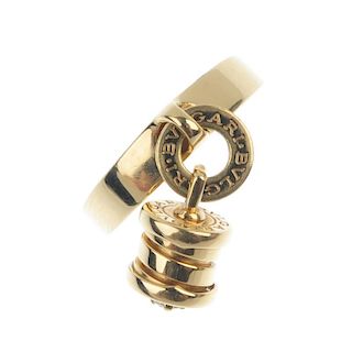 BULGARI - an 18ct gold diamond 'B.Zero1' charm ring. Designed as an articulated spiral charm, with b