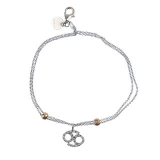 CHIMENTO - a diamond charm bracelet. The brilliant-cut diamond charm, with bead spacers, to the two-