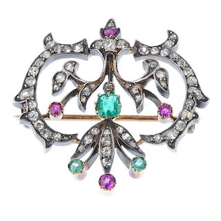 A late 19th century gold and silver ruby, emerald and diamond pendant. Of openwork design, the recta