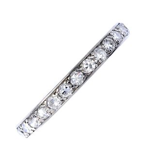A platinum diamond full-circle eternity ring. Designed as a series of pave-set single-cut diamonds,