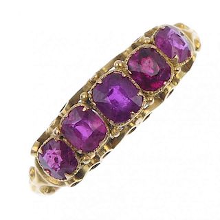 A late Victorian 15ct gold ruby five-stone ring, circa 1880. The graduated cushion-shape ruby line,