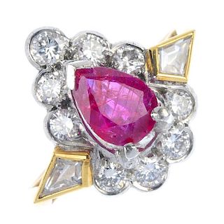 A ruby and diamond cluster ring. The pear-shape ruby, within a kite-shape and brilliant-cut diamond