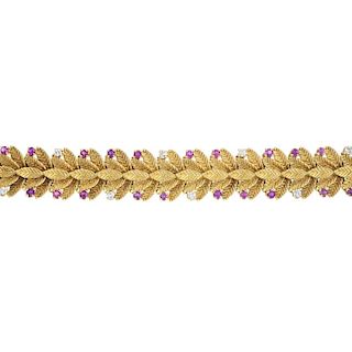 A 1960s 18ct gold, diamond and ruby bracelet. Comprising a series of foliate links with circular-sha