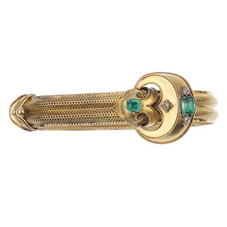 A mid Victorian gold foil-back emerald and diamond bracelet, circa 1860. Designed as a stylised buck