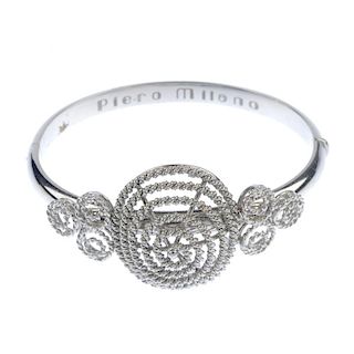 An openwork hinged bangle. The front designed as a rope-twist spiral, with similarly-designed trefoi