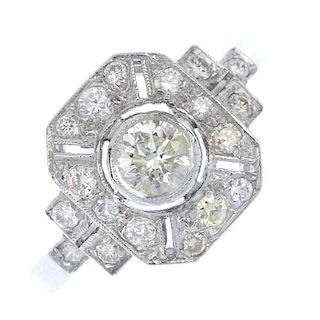 A diamond dress ring. The brilliant-cut diamond, within a millegrain border and pierced brilliant-cu