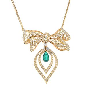 An emerald and diamond necklace. The openwork brilliant-cut diamond stylised bow, suspending a pear-