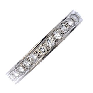 An 18ct gold diamond half-circle eternity ring. Designed as a series of pave-set diamonds, to the pl