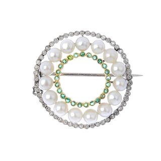 An early 20th century platinum and 18ct gold seed pearl, diamond and emerald wreath brooch. The seed