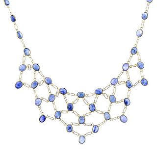 A sapphire bib necklace. The graduated oval-shape sapphires woven mesh, to the oval-shape sapphire b