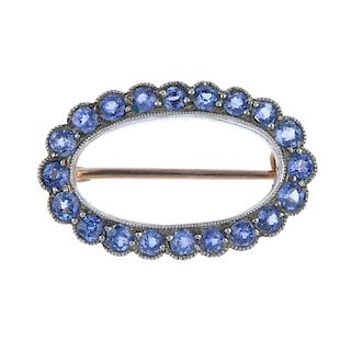 A silver and 9ct gold tanzanite wreath brooch. The circular-shape tanzanites, within a late 19th cen