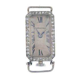 TIFFANY & CO. - a lady's early 20th century diamond watch head. The rectangular-shape cream dial wit