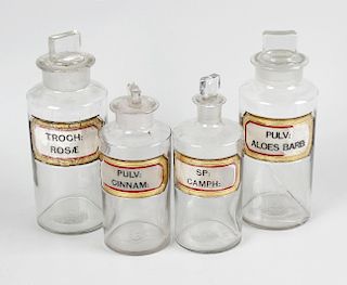 A group of sixteen apothecary jars, most by York Glass, each with gilt edged canted oblong label, in