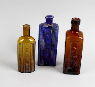 Two boxes containing a large collection of assorted glass bottles To include a box of amber examples