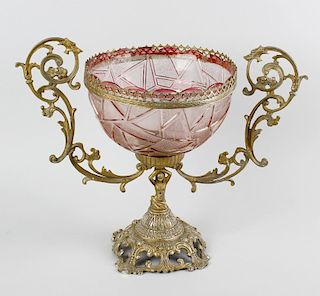 A coloured glass mounted centrepiece. The pink cut glass bowl having a lobed rim with plain and text