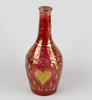 A 19th century gilt red glass bottle. Possibly 19th century, Ottoman Turkish, of Beykoz style having