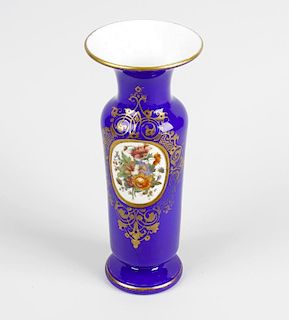 A Bohemian overlay glass vase. Of cylindrical form having waisted neck and footed base, decorated wi