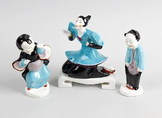 A group of three Royal Worcester Chinese figures, comprising a kneeling female number 3397, plus two