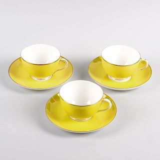 A Royal Worcester porcelain part tea service. Comprising four cups, sugar bowl, six saucers, six sid